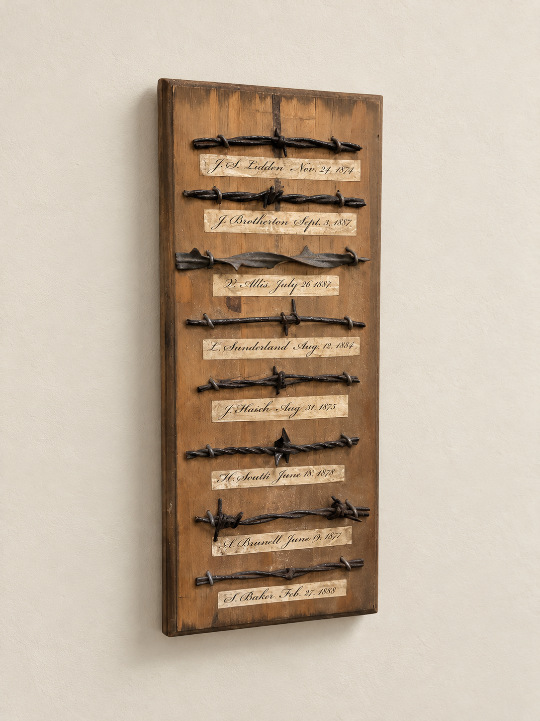 Collection of American Barbed Wire Patent Samples on Pine Board