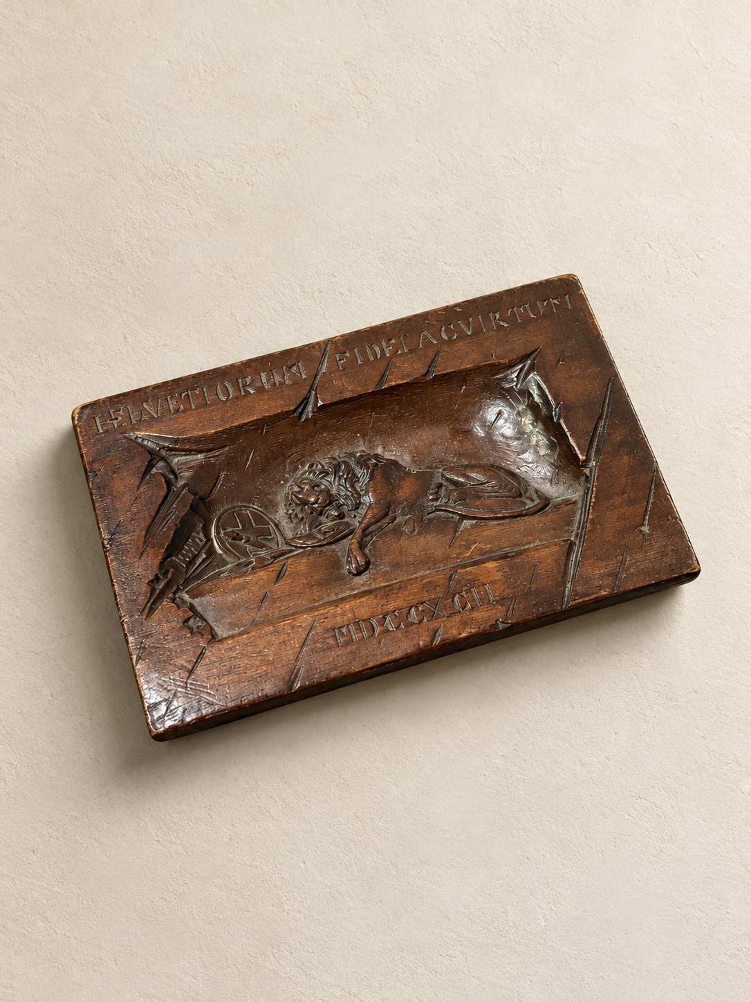 A Swiss Carved Wood Plaque of the Lion of Lucerne